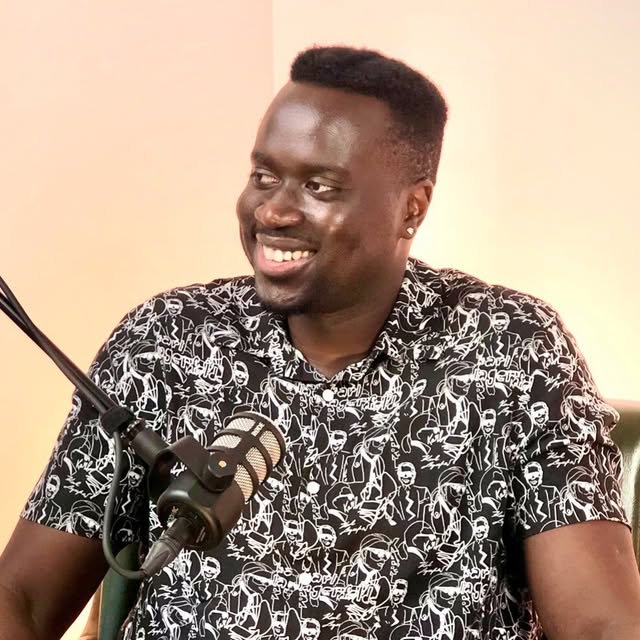 Jem Veda speaking into a microphone
